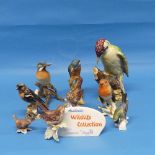 A small quantity of Goebel and other porcelain birds, to include a Goebel porcelain shop advertising