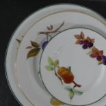 A Royal Worcester Evesham and Evesham Vale part Dinner and Tea Service, comprising cups and saucers,