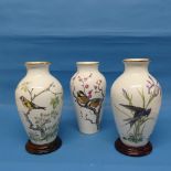 A pair of Franklin Mint Basil Ede Vases, to include The Woodland Bird and The Meadowland Bird with