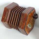 An early 20thC Concertina by Lachenal & Co., serial no. 31235, walnut mounted with 60 buttons (30