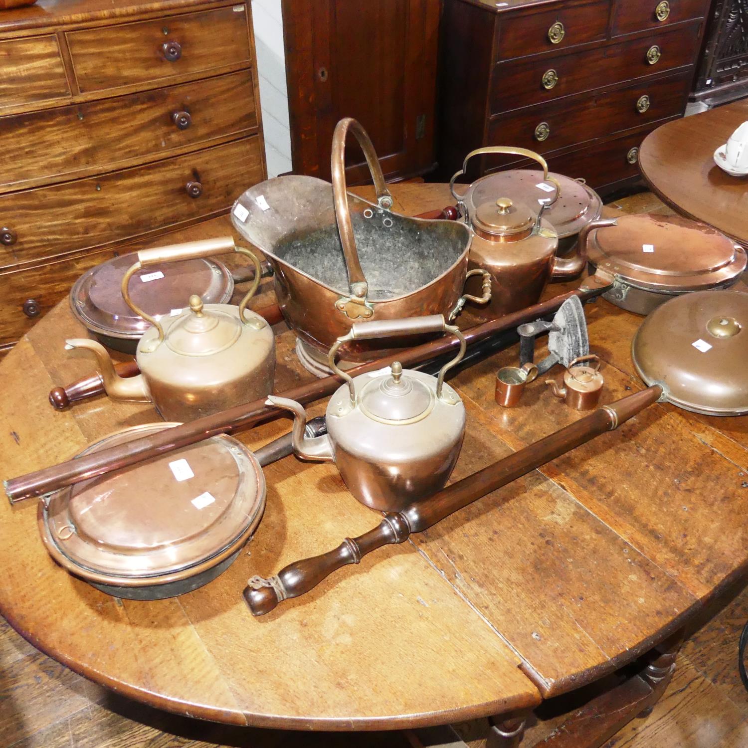 A quantity of antique Copperwares, to include five Warming Pans, two Kettles, Coal Scuttle, etc (a