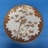 An Antique Japanes porcelain Charger, decorated with birds in a tree, painted marks to reverse,