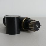 An early 20thC German field Microscope, the oxidised brass cylindrical case unscrewing to reveal