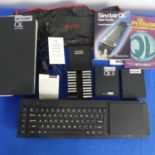 A Sinclair QL computer, together with a box of tapes, easel software, paperwork and accessories (