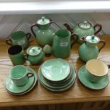 A Torquay pottery part Tea Service, including Cream Jugs, Tea Cups, etc, together with a