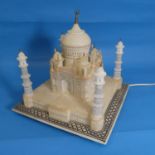 Alabaster lamp in the form of the Taj Mahal, raised on square base with geometric border