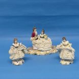 A Volkstedt-Rudolstadt porcelain Figural Group, depicting a man and woman seated on a chaise