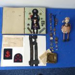 A collectors lot including a mid 20thC Girl Guide scrap book, badges, ribbons etc., together with an