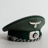 A W.W.2 German Nazi Luftwaffe officer's cap, constructed of doeskin wool with a bottle green central