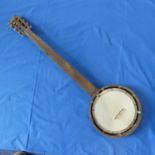 An Early wooden Banjo, with 5 strings, L87cm