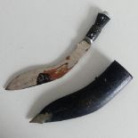 A Ghurka Kukri knife in sheath with lion head to base of handle, marked India on blade, some rust.