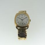 A 9ct gold Buren Grand Prix cushion cased gentleman's Wristwatch, the silvered dial with Arabic