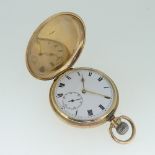 A 9ct gold Hunter Pocket Watch, the circular white enamel dial with black Roman numerals and