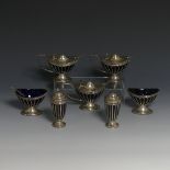 A George V silver seven piece Cruet Set, by Goldsmiths and Silversmiths, hallmarked London, 1910/11,