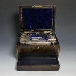 A Victorian brass mounted coromandel wood Vanity Box, with eleven silver mounted glass jars /