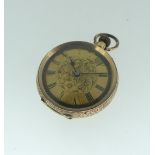A Continental 14k gold Fob Watch, the case with foliate engraved decoration, gilt dial with black