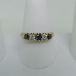 A sapphire and diamond five stone Ring, all mounted in 18ct yellow gold, Size Q, approx total weight