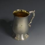 An Elizabeth II silver Mug, hallmarked Sheffield 1974, of baluster form in the George III style with