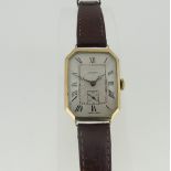 A 9ct gold cased Unicorn Wristwatch, the rectangular gold case with canted corners, silvered dial,