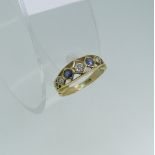 A graduated seven stone sapphire and diamond Ring, the central diamond approx. 0.1ct, all mounted in