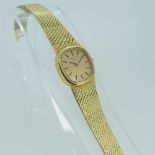 An 18ct gold Longines lady?s Wristwatch, the rounded square champagne dial with raised baton