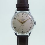 A vintage Smiths De Luxe getleman's Wristwatch, the circular silvered dial with gilt raised Arabic