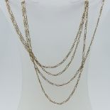 A 15ct yellow gold Guard Chain, the oval links with three smaller circular links between, 152cm