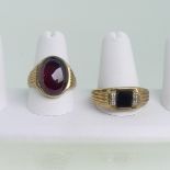 A 9ct yellow gold Gentleman's Signet Ring, set with on oval cabochon rhodolite garnet and with