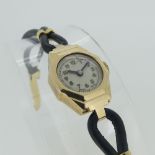A 9ct gold lady's Wristwatch, the octagonal case with circular dial, on black leather 'shoelace'