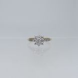 A diamond flowerhead Cluster Ring, the central brilliant cut stone c.¼ct, surrounded by eight