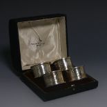 A cased set of four George V silver Napkin Rings, by Walker & Hall, hallmarked Sheffield, 1927/8, of