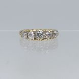 A graduated five stone diamond Ring, the centre stone approx 0.5ct, all mounted in yellow metal in a