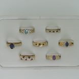 A small amethyst Ring, collet set in 9ct gold, Size M, together with three other 9ct gold rings,