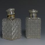 A pair of Victorian silver mounted glass Scent Bottles, by Charles Asprey & Charles Asprey junior,