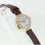 A gold Tudor lady?s Wristwatch, the octagonal case with silvered circular dial, black Arabic