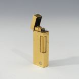 A Dunhill gold plated Cigarette Lighter, leaf design, with original slip case, booklet, guarantee