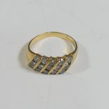 An 18ct yellow gold and diamond Ring, the front with five slanted rows of three diamonds, approx