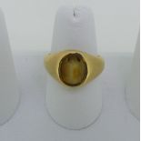 A citrine Signet Ring, the oval stone mounted in unmarked yellow gold, tested as 18ct, Size O½,