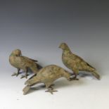 A cast metal Pigeon Decoy, together with two others similar, all with remnants of gilding and