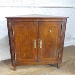 A 19thC inlaid mahogany Corner Cupboard, with double doors and shelved interior, raised on square