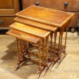 An Edwardian mahogany Nest of four Tables, raised on moulded legs and sledge feet, the largest: W