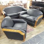 An Art Deco style black leatherette Three Piece Suite, with reeded light wood arms and replacement
