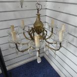 A vintage brass seven branch Chandelier, with crystal drops, 52cm diameter.