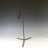 An antique wrought iron 'Pearman' Lamp or Rushnip, with cylindrical stem, on tripod base, H 62cm.