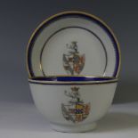 An 18thC Chinese export armorial porcelain Teabowl and Saucer, decorated with gilt and blue