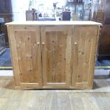 A vintage pine Cupboard/ low Wardrobe, with one large and one small cupboard with turned wood