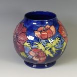 A Moorcroft 'Anenome' pattern Bulbous Squat Vase, tube lined decoration on cobalt blue ground, of