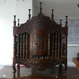 A 19thC French provincial carved walnut Bread Hutch , the front with carved foliate and urn