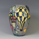 A Moorcroft 'Balloon' pattern Baluster Vase, tube lined decoration on grey ground, with factory