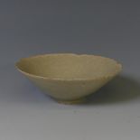 An antique Song Dynasty-style footed Bowl, in celadon glaze, chips to rim and hairline cracks,